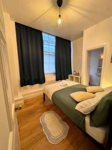 Postel nebo postele na pokoji v ubytování Cool Place Holborn + 9 fotografií