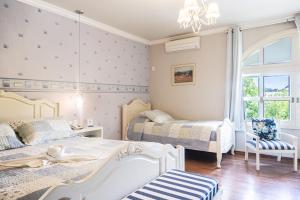 Cama ou camas em um quarto em Doce Canela - Pousada de Charme