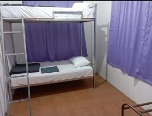 Letto o letti in una camera di Mystik Muthu View Resort