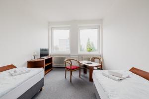 Postel nebo postele na pokoji v ubytování hotel Dobruška + 33 fotografií