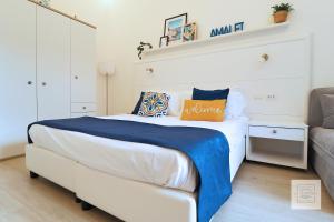 A bed or beds in a room at La Terrazza Family Holidays - Sorrento Coast