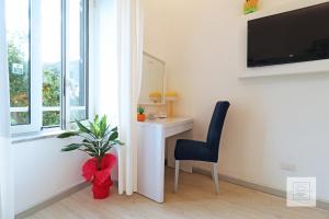 A television and/or entertainment centre at La Terrazza Family Holidays - Sorrento Coast