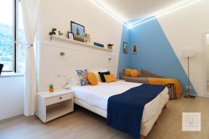 A bed or beds in a room at La Terrazza Family Holidays - Sorrento Coast
