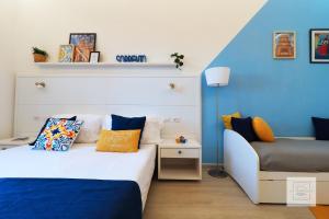 A bed or beds in a room at La Terrazza Family Holidays - Sorrento Coast