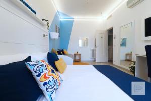 A bed or beds in a room at La Terrazza Family Holidays - Sorrento Coast