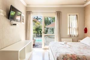 Cama ou camas em um quarto em Doce Canela - Pousada de Charme mais 37 fotos