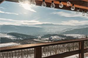 a view from a window of a mountain view at Domek Nad Sadem in Łącko
