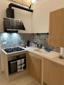 Kuchyň nebo kuchyňský kout v ubytování Dimora Suite 36 + 25 fotografií