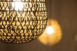 a close up of a chandelier at Haraki Village in Haraki