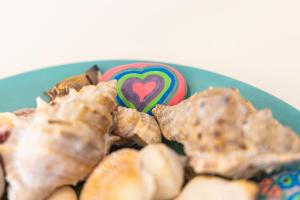 a blue plate of food with a heart cookie at Haraki Village in Haraki