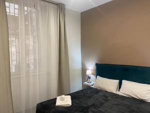 Postel nebo postele na pokoji v ubytování Doria Suites Napoli