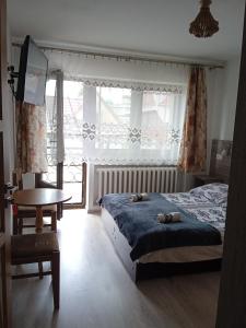 Posteľ alebo postele v izbe v ubytovaní Pokoje Gościnne U Babuni