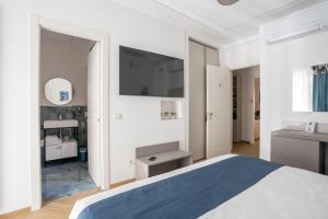 Postel nebo postele na pokoji v ubytování Hezio Guest House