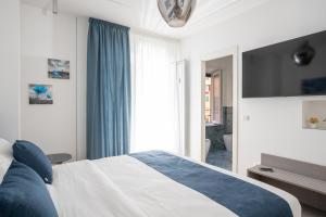 Postel nebo postele na pokoji v ubytování Hezio Guest House