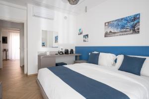 Postel nebo postele na pokoji v ubytování Hezio Guest House