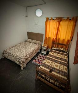 Ένα ή περισσότερα κρεβάτια σε δωμάτιο στο Casita Festiva