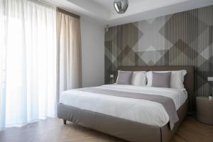 Postel nebo postele na pokoji v ubytování Hezio Guest House