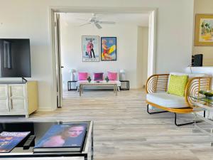 a living room with a couch and a table at Bright Avalon Villa W Ocean Views & Hot Tub in Avalon