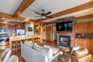 a living room with a couch and a fireplace at Endless Grandfather View at Echota in Valle Crucis