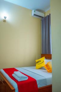 Ένα ή περισσότερα κρεβάτια σε δωμάτιο στο Villa Deluxe Lodge