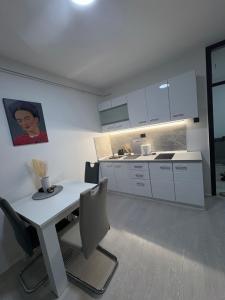 Η κουζίνα ή μικρή κουζίνα στο Fenix Apartman III