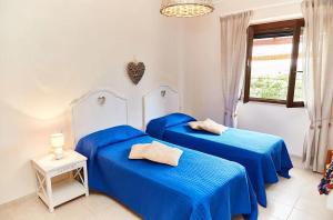 A bed or beds in a room at Tenuta Saracone