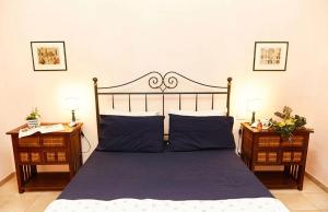 A bed or beds in a room at Tenuta Saracone