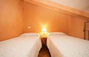 A bed or beds in a room at Tenuta Saracone