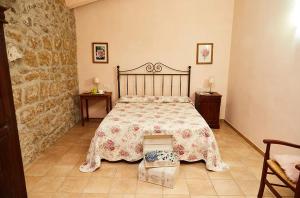 A bed or beds in a room at Tenuta Saracone