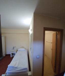 Postel nebo postele na pokoji v ubytování Guest House ANEX