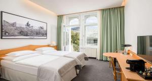Postel nebo postele na pokoji v ubytování Best Western Hotel Moran + 37 fotografií