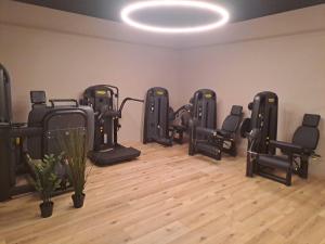 a row of exercise equipment in a room at Hotel Alla Dolina in Sistiana