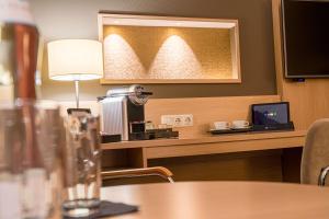 Μια τηλεόραση ή/και κέντρο ψυχαγωγίας στο Best Western Premier Central Hotel Leonhard