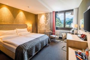 Ένα ή περισσότερα κρεβάτια σε δωμάτιο στο Best Western Premier Central Hotel Leonhard