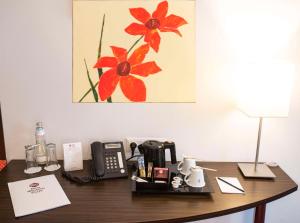 a office desk with a phone at Best Western Plus Amedia Wien in Vienna