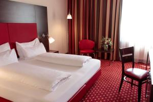 En eller flere senger på et rom på Best Western Plaza Hotel Wels