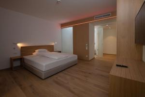 Postel nebo postele na pokoji v ubytování Best Western Hotel Spinnerei Linz
