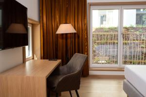 TV a/nebo společenská místnost v ubytování Best Western Hotel Spinnerei Linz