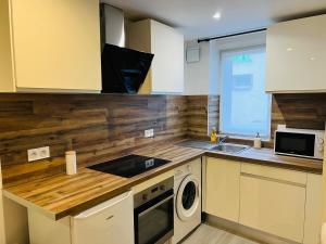 Kuchyň nebo kuchyňský kout v ubytování Cosy home - Wifi - Netflix + 1 fotografie