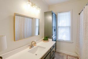 a bathroom with a sink and a mirror at Walk to Oxford Square and Ole Miss Central Home! in Oxford +18 photos