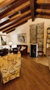 a living room with a couch and a fireplace at Sottocastello 2 in Gorizia