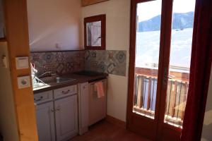 a kitchen with a sink and a window at La petite maison d 'Ascou in Ascou +53 photos