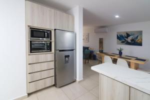 Kuchyň nebo kuchyňský kout v ubytování Oasis costero Acogedora Casa Familiar