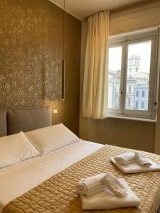 Postel nebo postele na pokoji v ubytování Le Due Torri ROOMS