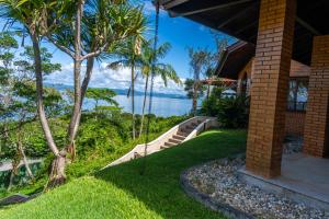 a view of the ocean from a house at Mansão VOAR in Florianópolis