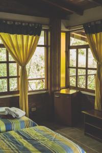 Postel nebo postele na pokoji v ubytování Hostal Las Palmas + 37 fotografií