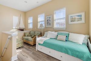 a bedroom with a bed and a chair and windows at Casa Del Mar in Panama City Beach +18 photos
