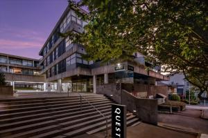 an office building with stairs in front of it at Quest Parnell Serviced Apartments in Auckland