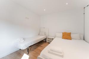 Postel nebo postele na pokoji v ubytování Feel Welcome Barcelona Smart flat
