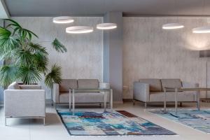a waiting room with two couches and a table at Best Western Hotel Vista in Ostrava +166 photos